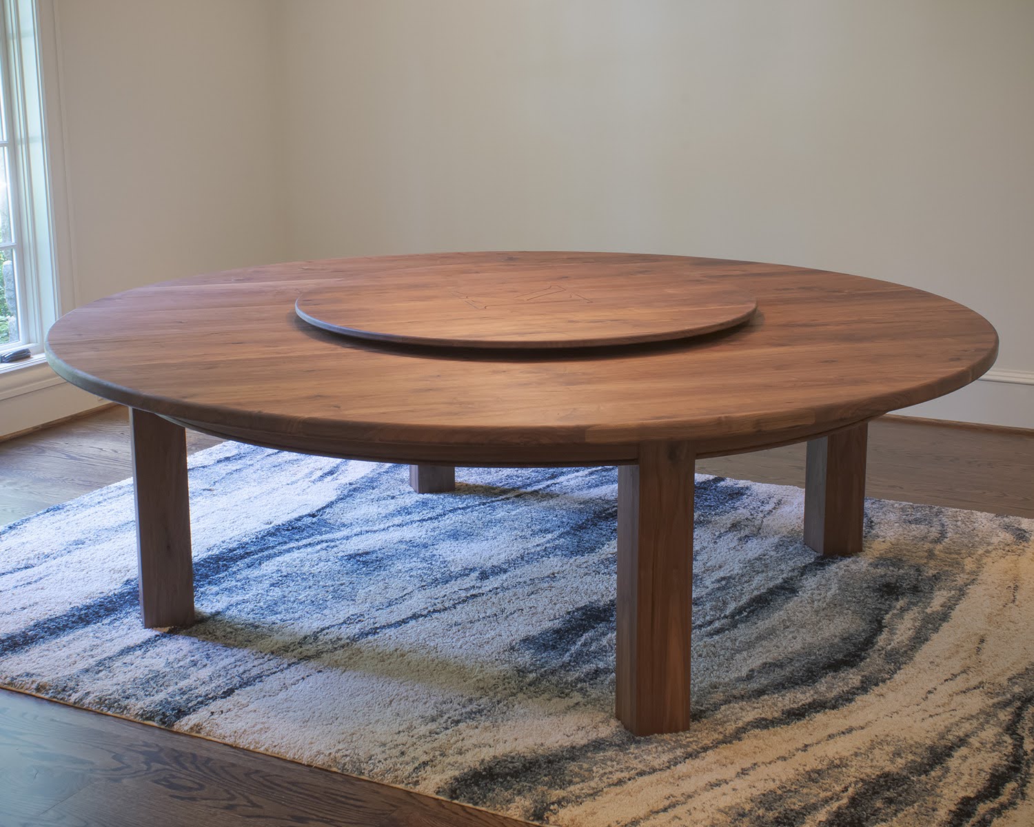 Round solid walnut dining table